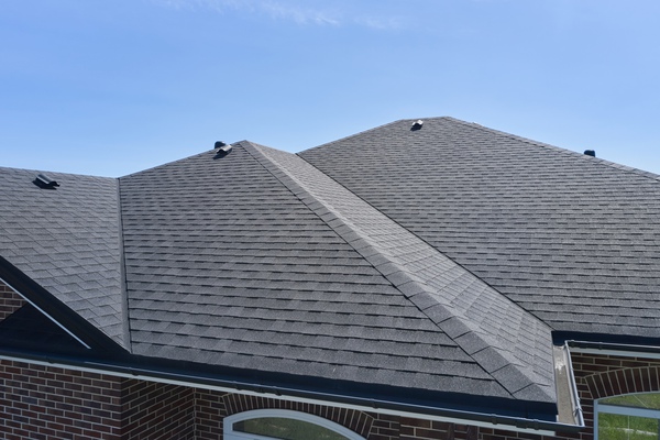 Close-up of completed modern gray roof for residential roofing installation